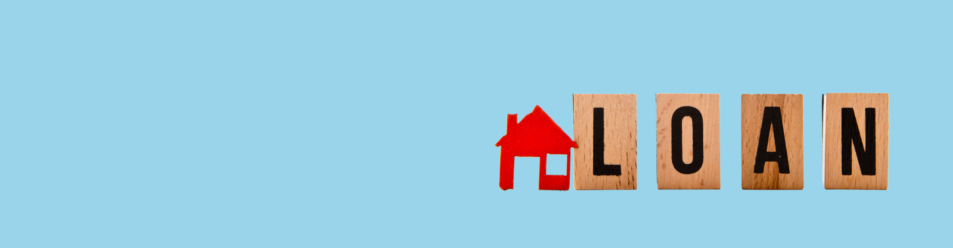 Word “loan” spelled with wooden blocks next to a house icon, representing home loans, mortgage solutions, and lending services with Innovest advisers in New Zealand.